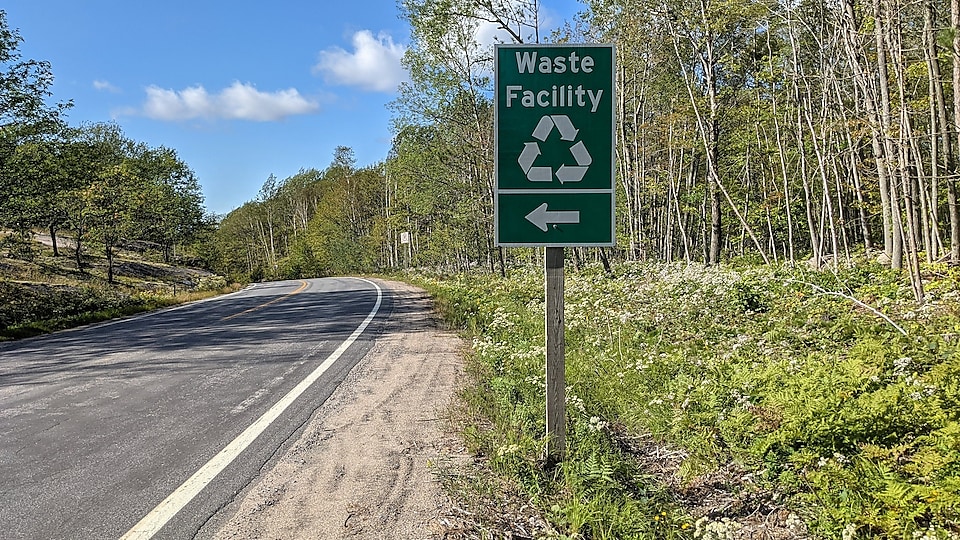 Recycle  facility road sign