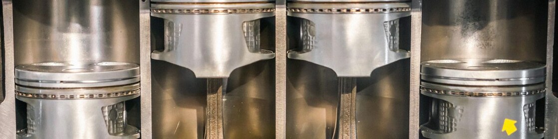 Scientist holding a clean piston.