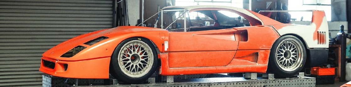 Mike Burroughs’ Ferrari time attack build features a Honda K-series swap and tube-chassis fabrication.