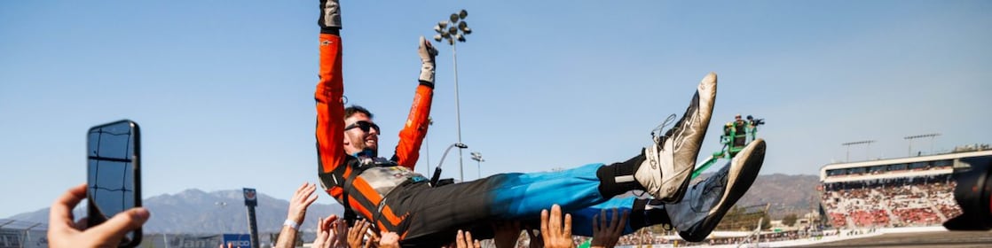 James Deane celebrates with his team after clinching the 2024 Formula DRIFT PRO Championship at Irwindale Speedway.