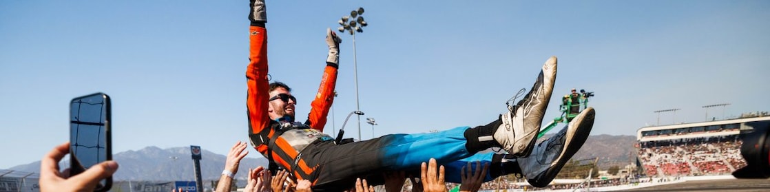 James Deane celebrates with his team after clinching the 2024 Formula DRIFT PRO Championship at Irwindale Speedway.