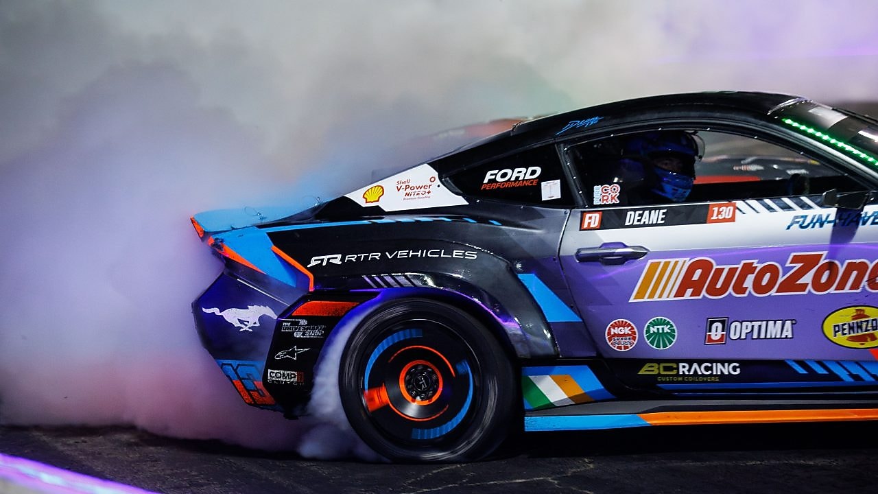 James Deane powers through a high-intensity drift in his AutoZone Ford Mustang RTR Spec 5-FD.