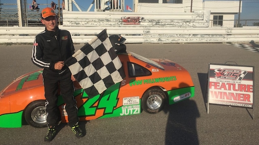 A person standing next to a race car