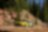 A yellow race car on a dirt road