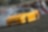 A yellow race car on a track