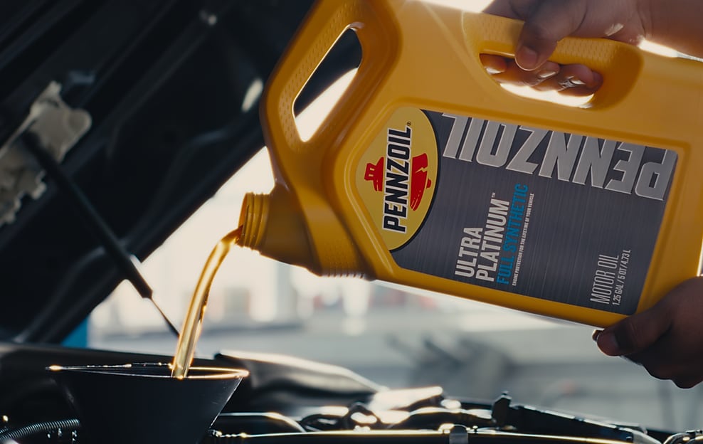 oil pouring into motor