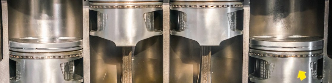 Scientist holding a clean piston. 