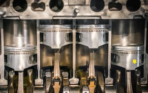 Scientist holding a clean piston.