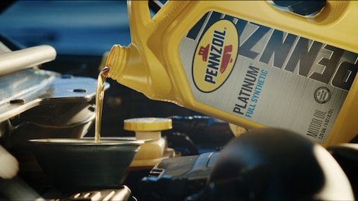 oil pouring into motor