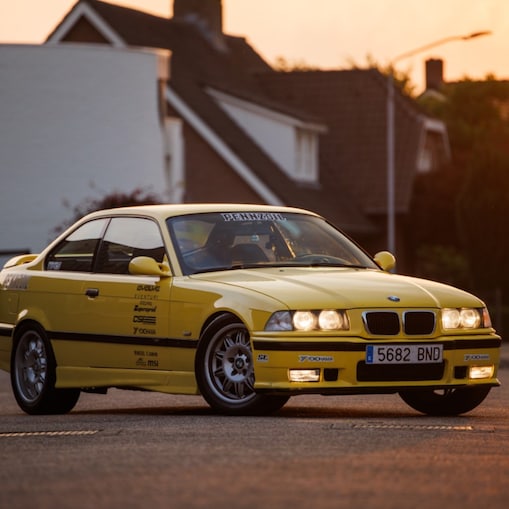 Larry Chen’s yellow M3, a striking tribute to classic BMW styling.