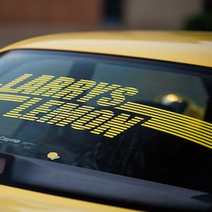 Larry’s Lemon’ proudly displayed on the rear window of the M3.