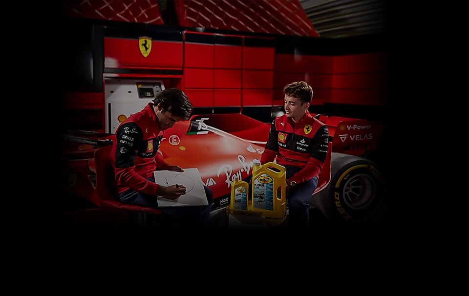 Carlos and Charles in front of the Scuderia Ferrari