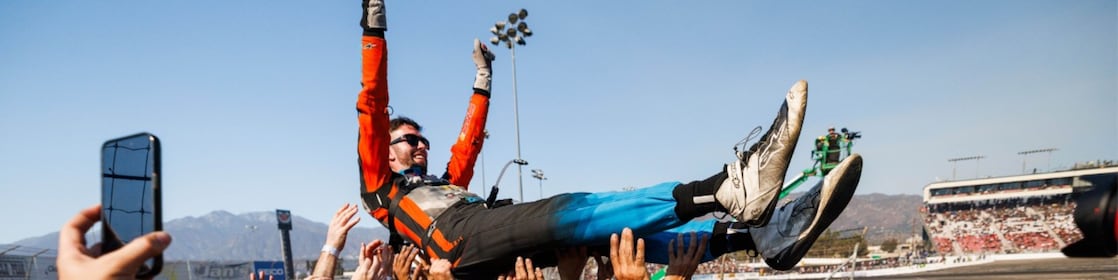 James Deane celebrates with his team after clinching the 2024 Formula DRIFT PRO Championship at Irwindale Speedway.