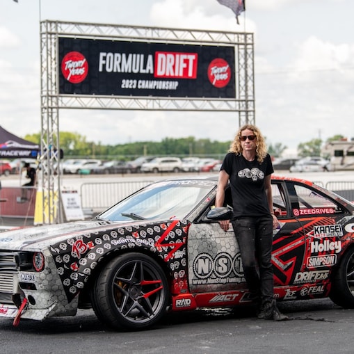 A person standing next to a car