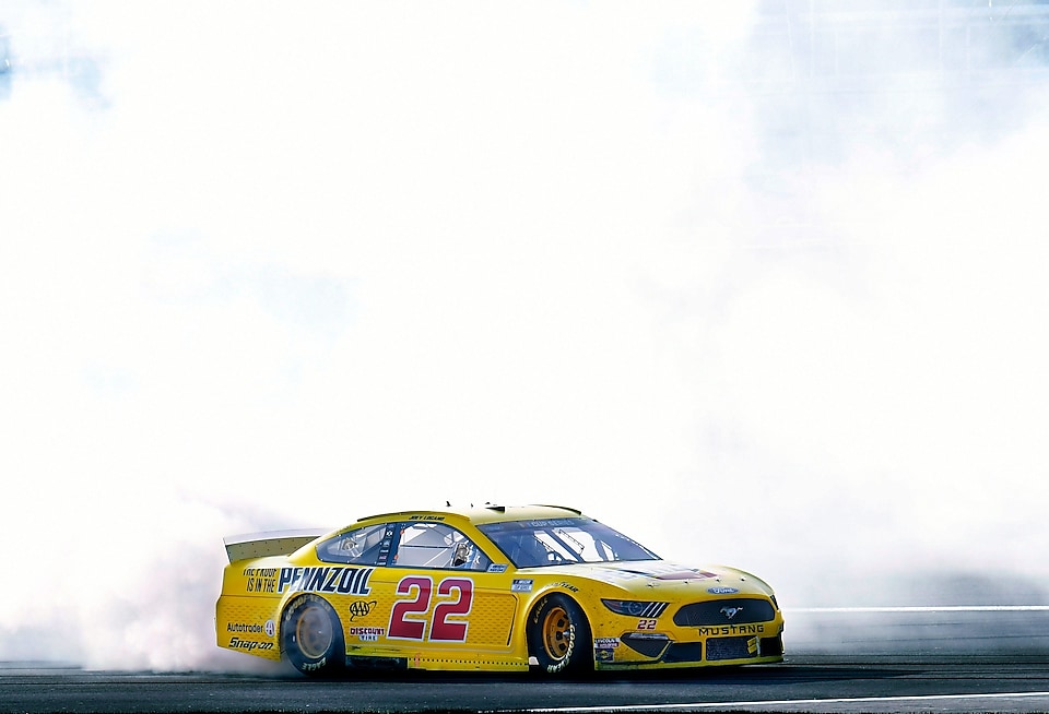 Joey Logano races into victory lane