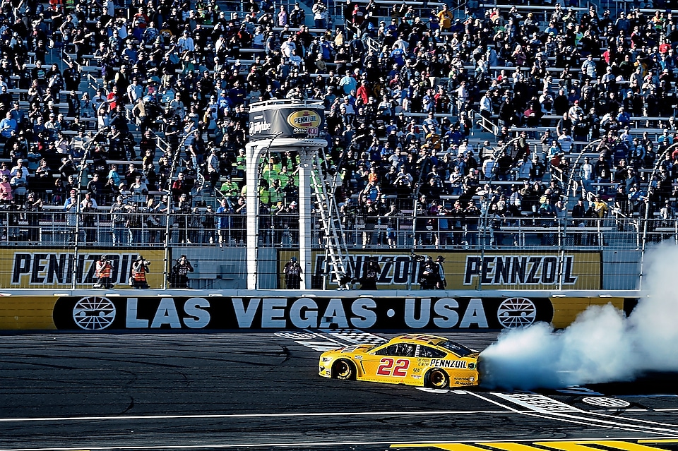 Joey Logano races into victory lane