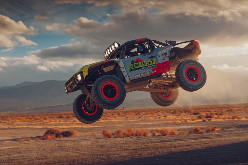 Off-road vehicles get airborne in the deserts of Los Angeles California, USA.