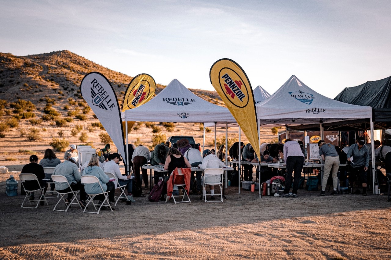 Rebelle U Participants Gather Under Tents For Hands-On Training