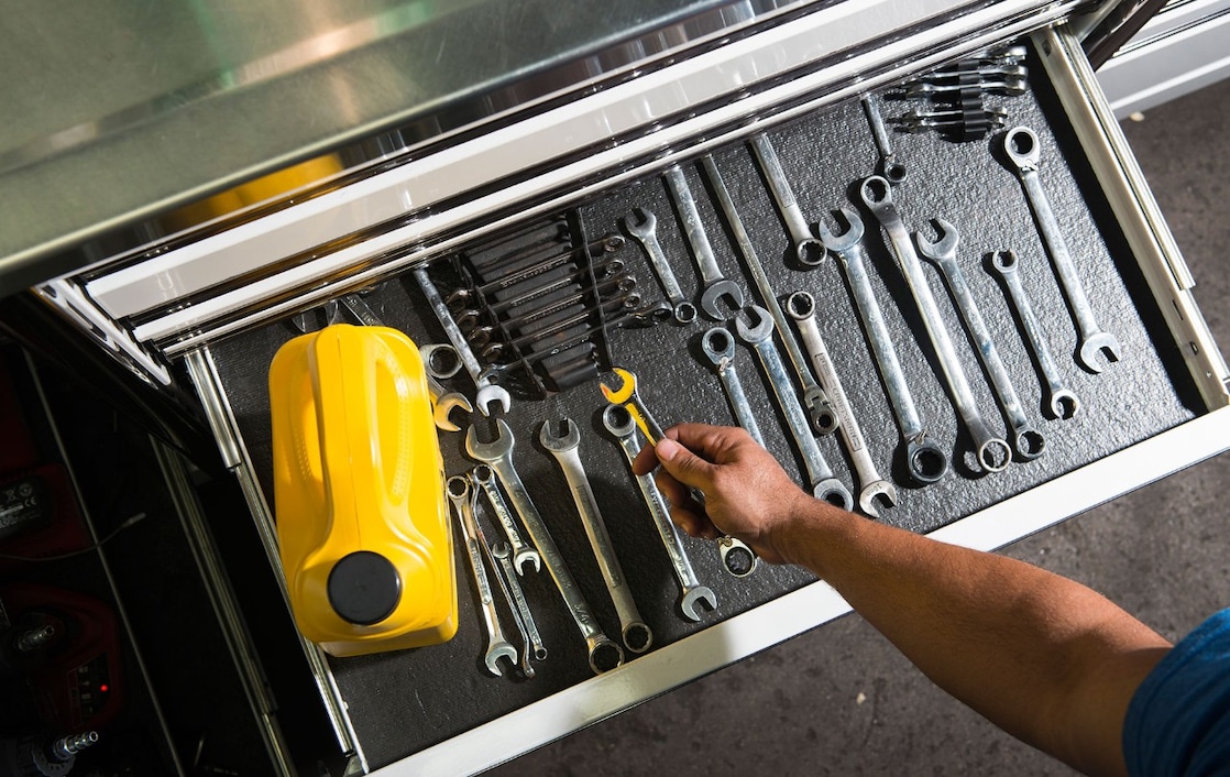 mechanic tools and Pennzoil oil bottle