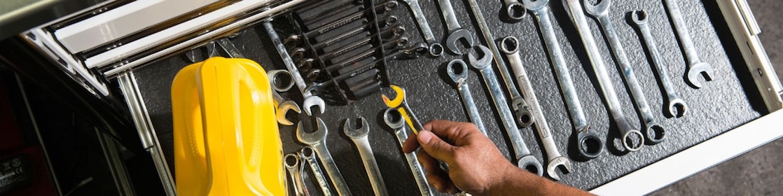 mechanic tools and Pennzoil oil bottle