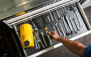 mechanic tools and Pennzoil oil bottle